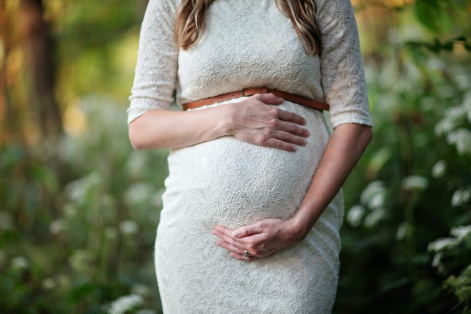 Pregnant woman holding baby bump